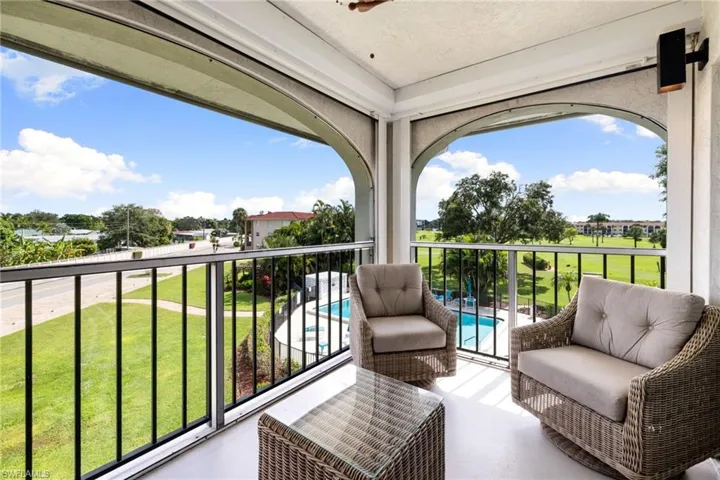 Balcony with view of pool