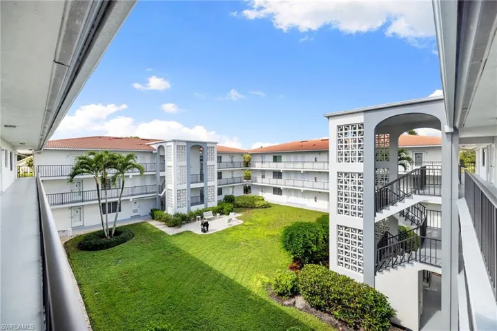 View of apartment building / complex with stairs