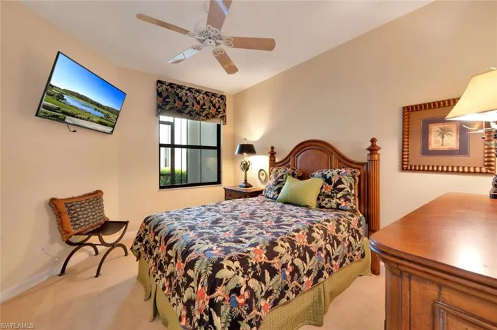 Bedroom featuring carpet and ceiling fan