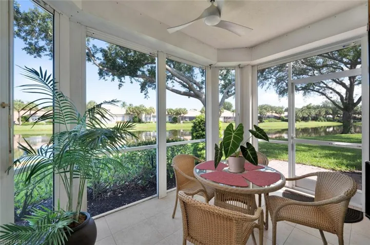 Lanai featuring a water view, plenty of natural light, and ceiling fan
