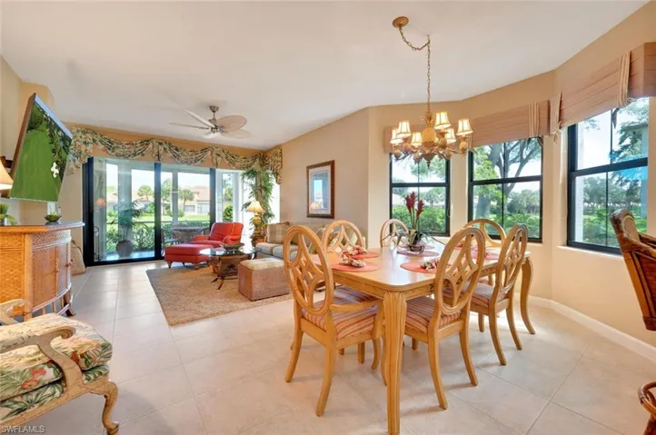 Dining space featuring plenty of natural light, light tile floors, and ceiling fan.
