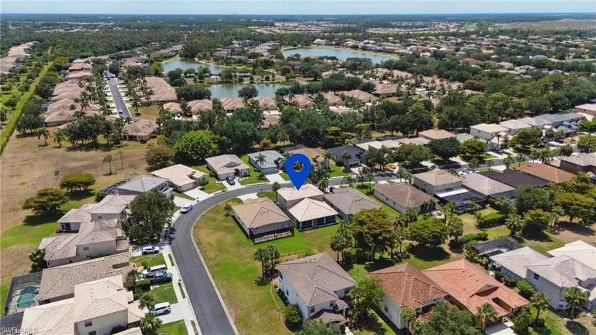 Aerial view featuring a water view and a residential view