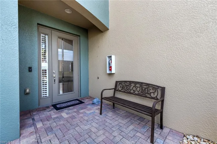 View of exterior entry with luxury glass insert door