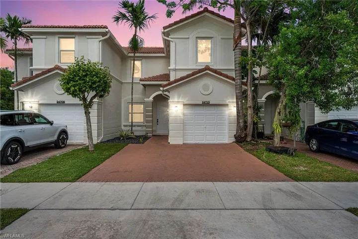 Mediterranean / spanish-style home with a garage