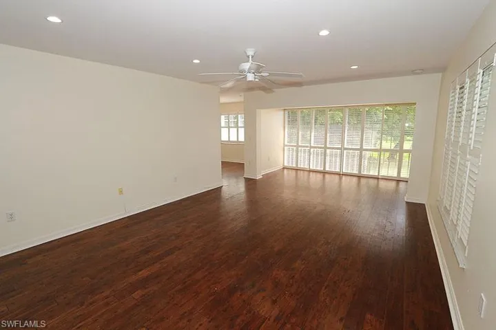 Spare room featuring dark wood finished floors, recessed lighting, and ceiling fan