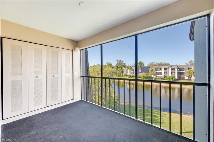 Unfurnished sunroom featuring a water view