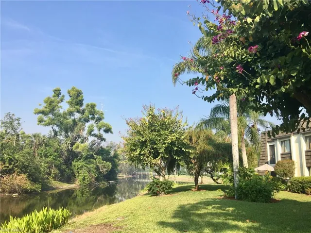 View of green lawn with a water view
