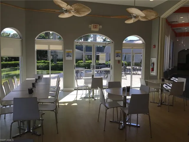Dining room featuring wood finished floors and a ceiling fan