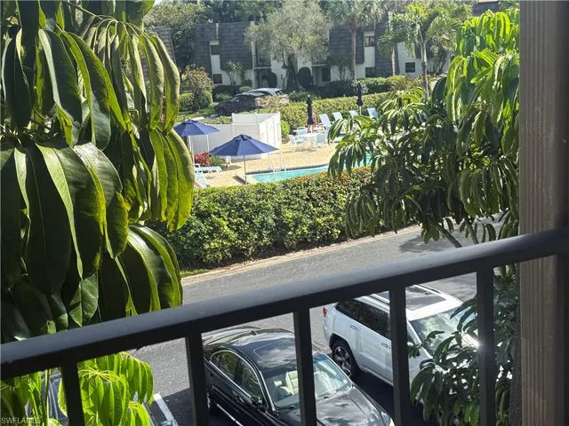 Balcony with view of pool