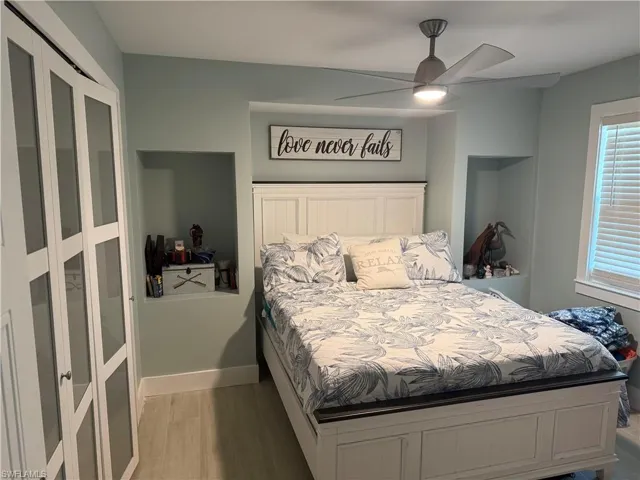 Bedroom featuring light wood-type flooring and a ceiling fan