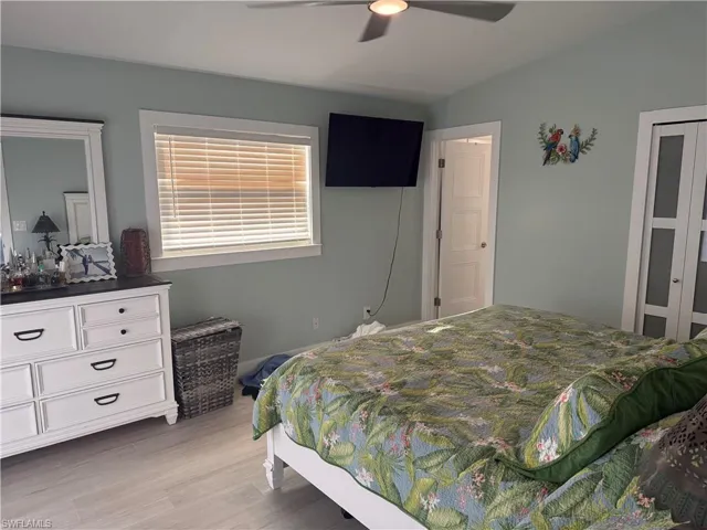 Bedroom featuring light wood-style flooring and ceiling fan