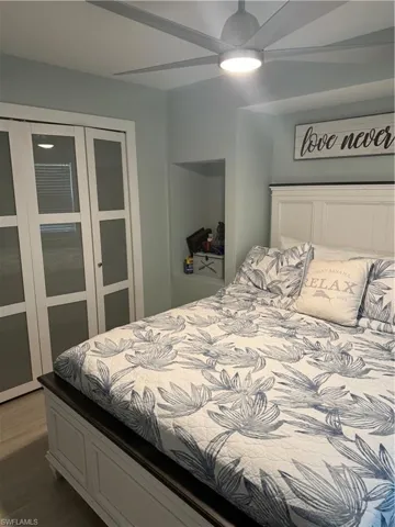 Bedroom with a closet and wood finished floors