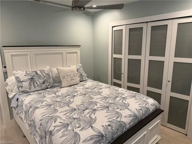 Bedroom with light wood-type flooring and ceiling fan