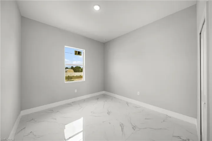 Empty room with light marble finish floors