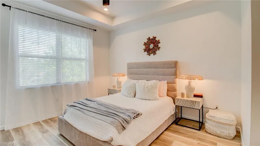 Bedroom featuring light wood-type flooring and recessed lighting