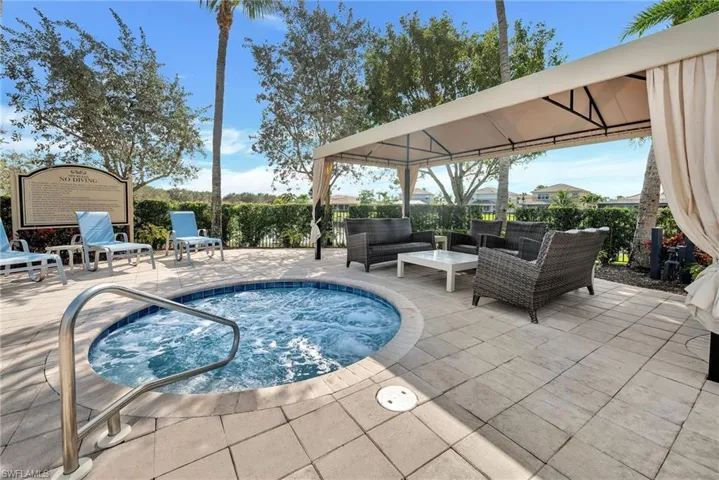 Heated jacuzzi with plenty of seating.