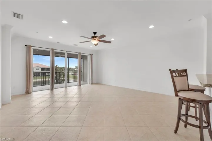 Expansive living room open to the kitchen and the lanai.