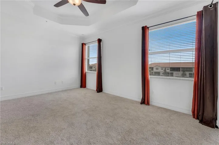 Master bedroom with new carpeting and new window glass.