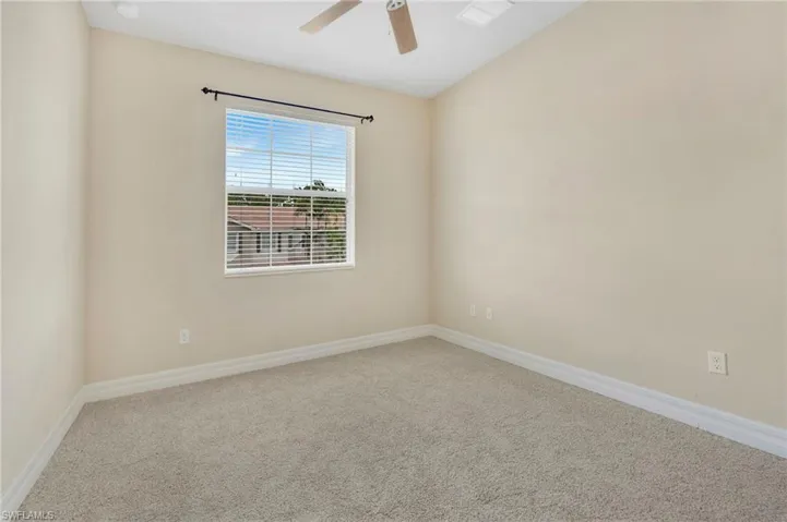 Guest bedroom with new carpeting and large closet.