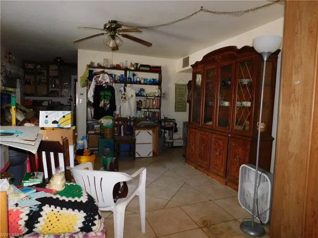 Dining room featuring ceiling fan and light tile patterned floors