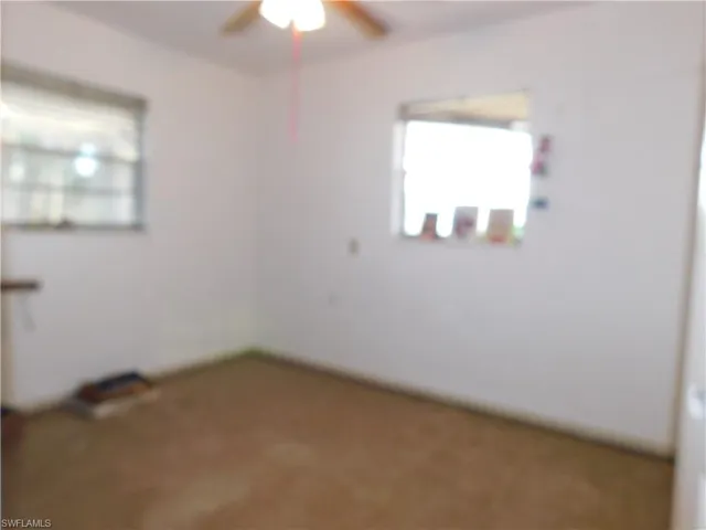 Spare room with a ceiling fan