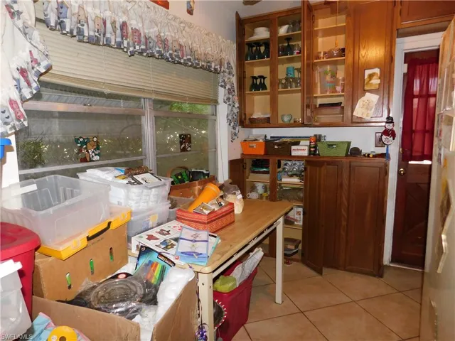 Kitchen with light tile patterned floors