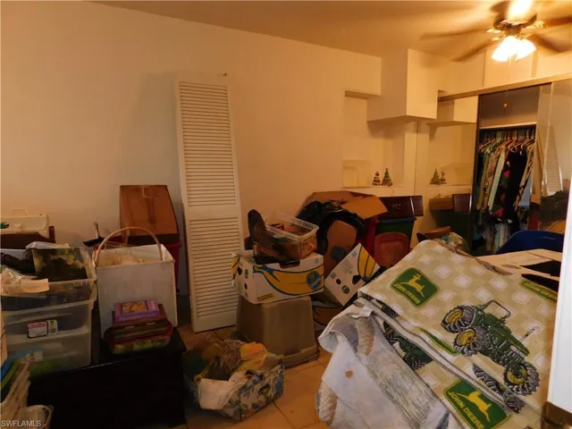 Bedroom with a closet and ceiling fan