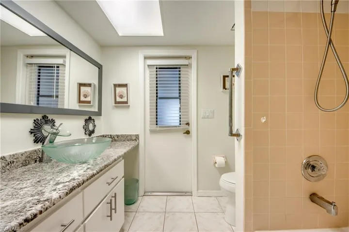 Additional bathroom with tiled shower and vanity—updated and functional for Cape Coral living.