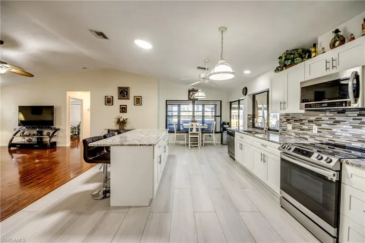 Wide-angle kitchen view highlighting open layout and ample counter space.