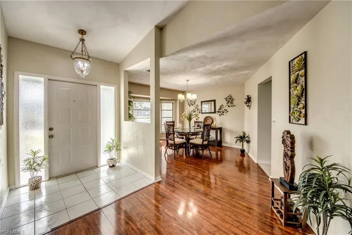 Bright entry foyer with vaulted ceiling and open sightlines into the main living areas.