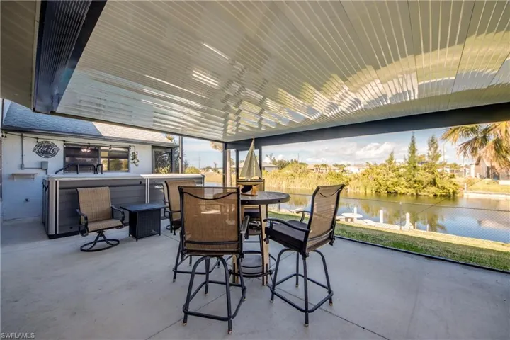 Covered patio and outdoor entertaining area—perfect for enjoying Cape Coral waterfront evenings.