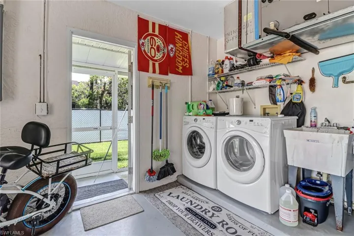 Laundry room featuring independent washer and dryer