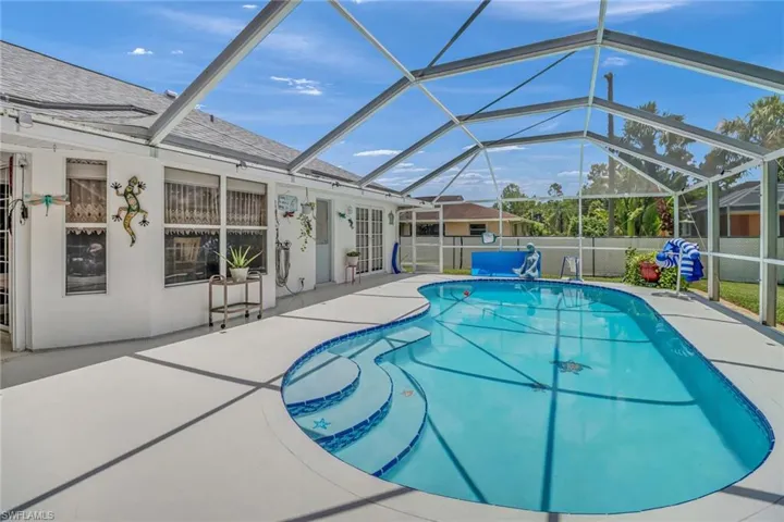View of pool featuring a patio and a lanai