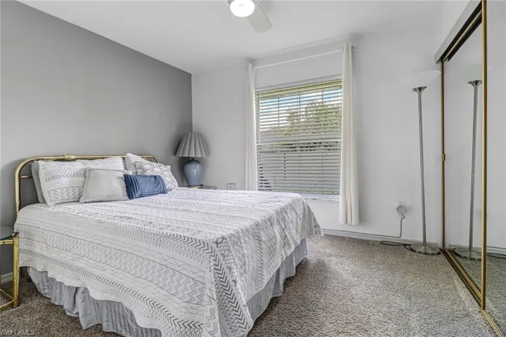 Bedroom featuring a closet, carpet flooring, and ceiling fan