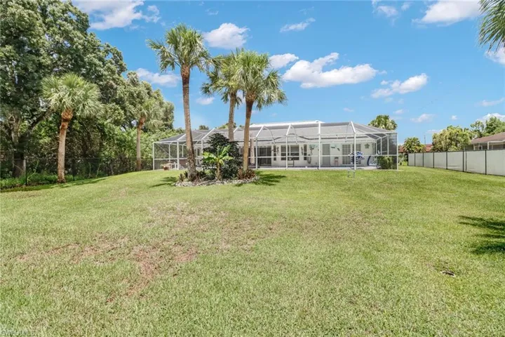 View of yard featuring a lanai