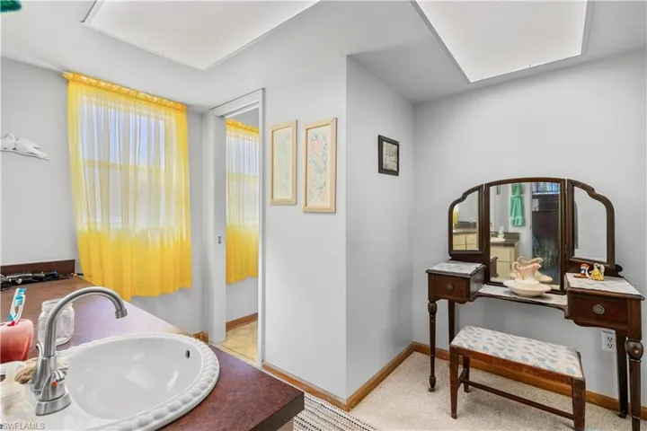 Bathroom with tile patterned flooring and vanity