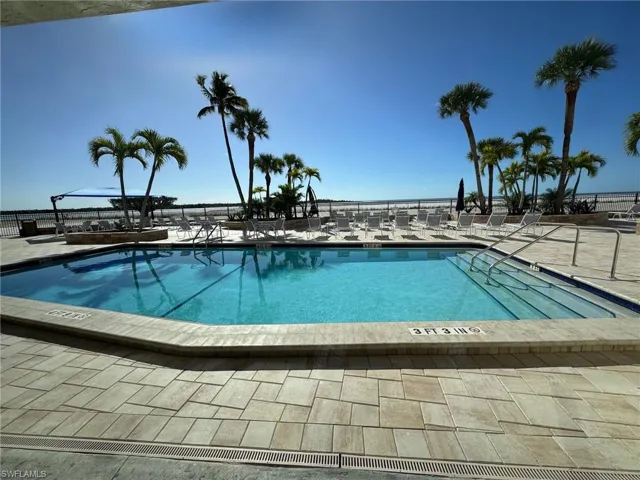 Community pool with a patio area