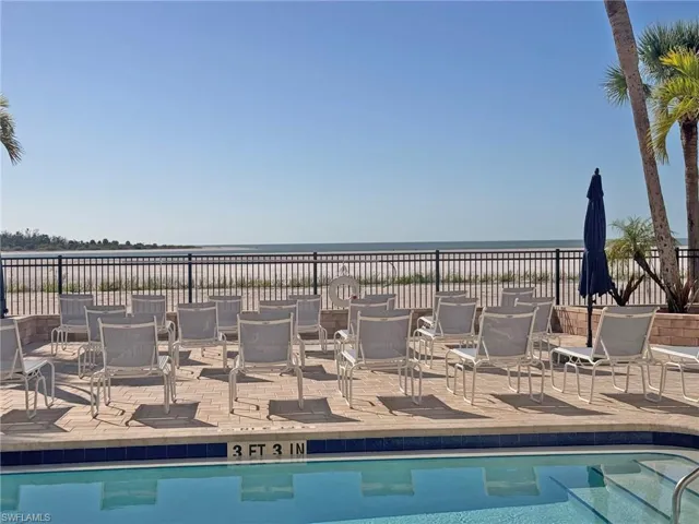 Community pool with a water view