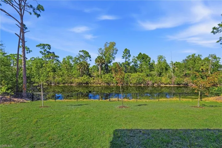 View of yard with a water view