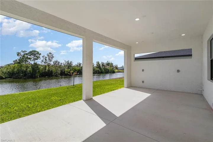 View of patio with a water view