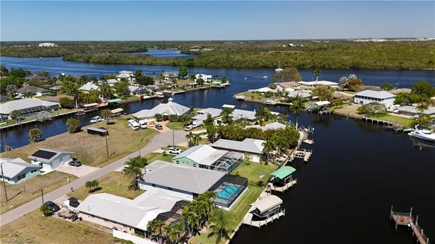 Aerial view of property's location featuring nearby suburban area