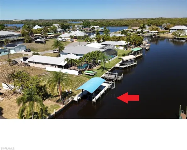 Aerial perspective of suburban area with a large body of water