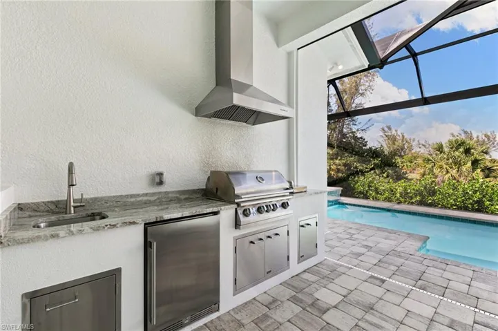 Gas grill, refrigerator and sink for convenience.