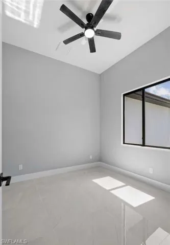 Spare room with ceiling fan