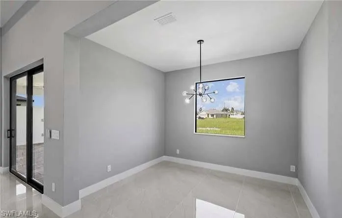 Unfurnished dining area featuring an inviting chandelier