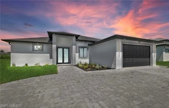 Prairie-style house featuring a garage