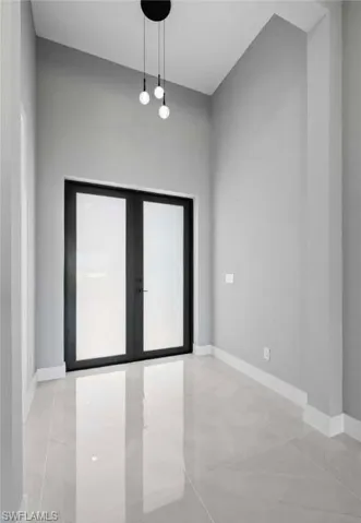 Empty room with french doors