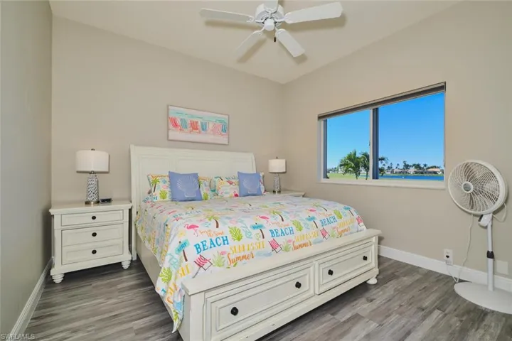 Bedroom featuring dark wood finished floors and a ceiling fan