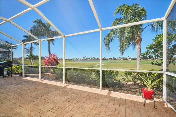 Unfurnished sunroom with view of golf course
