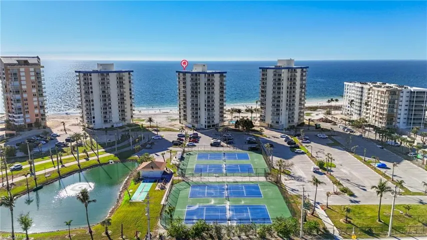 Bird's eye view featuring a water view and a view of the beach